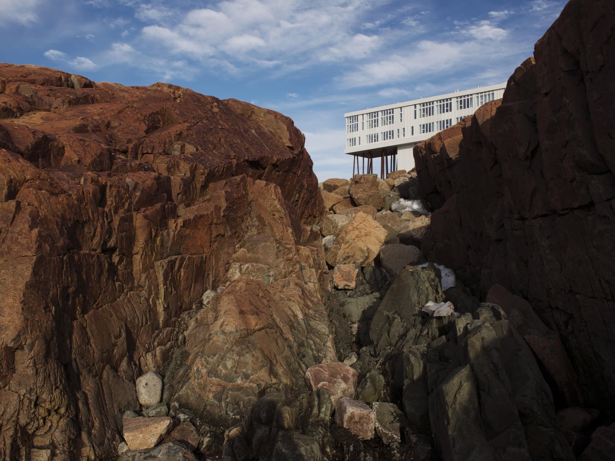 The Fogo Island Inn is nestled in the rocky landscape of Fogo Island.