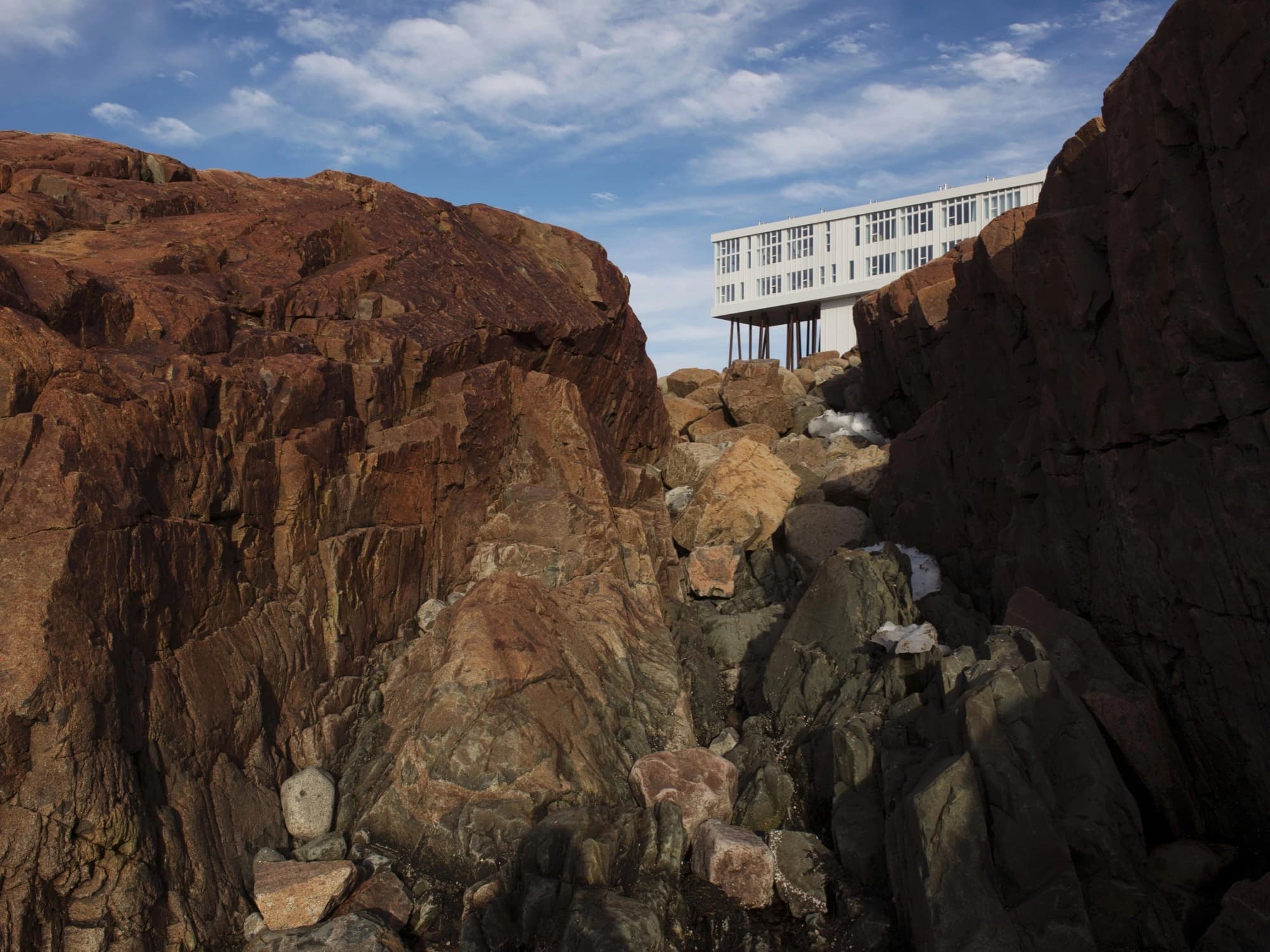The Fogo Island Inn is nestled in the rocky landscape of Fogo Island.