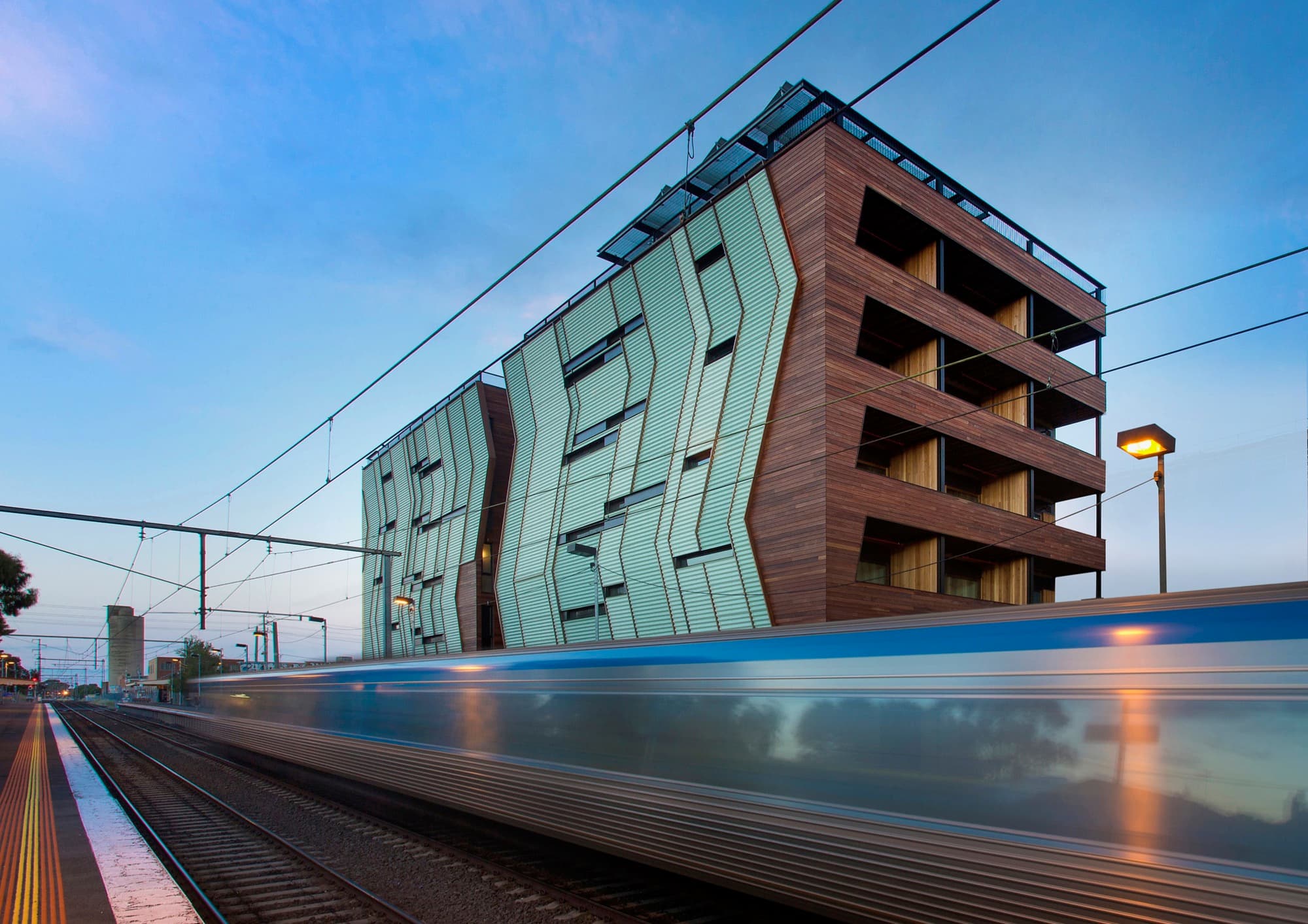 The western façade of The Commons overlooks one of Melbourne’s train lines. The Commons, Breathe Architecture