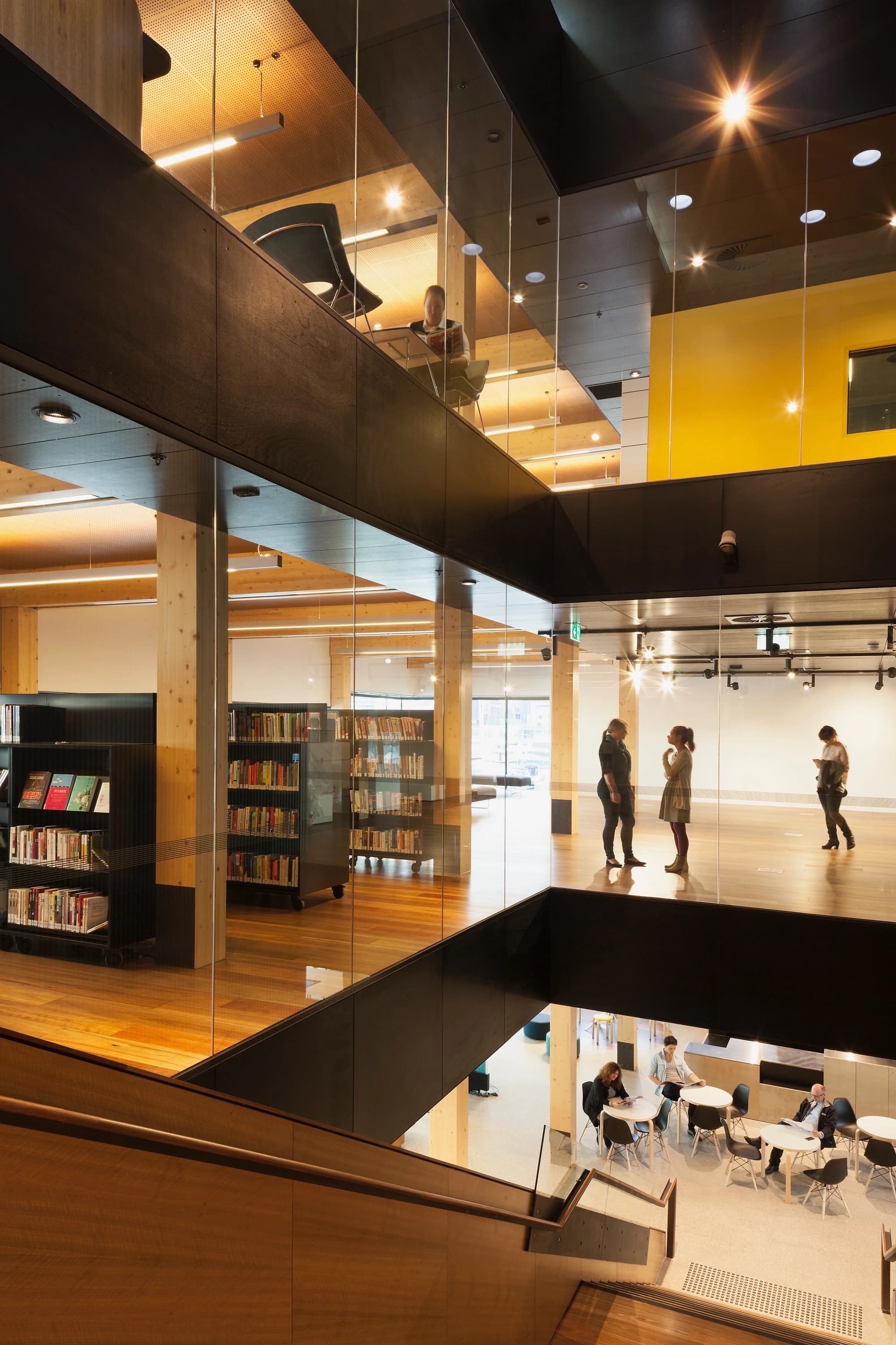 A vertical stair provides visual connections throughout the building.